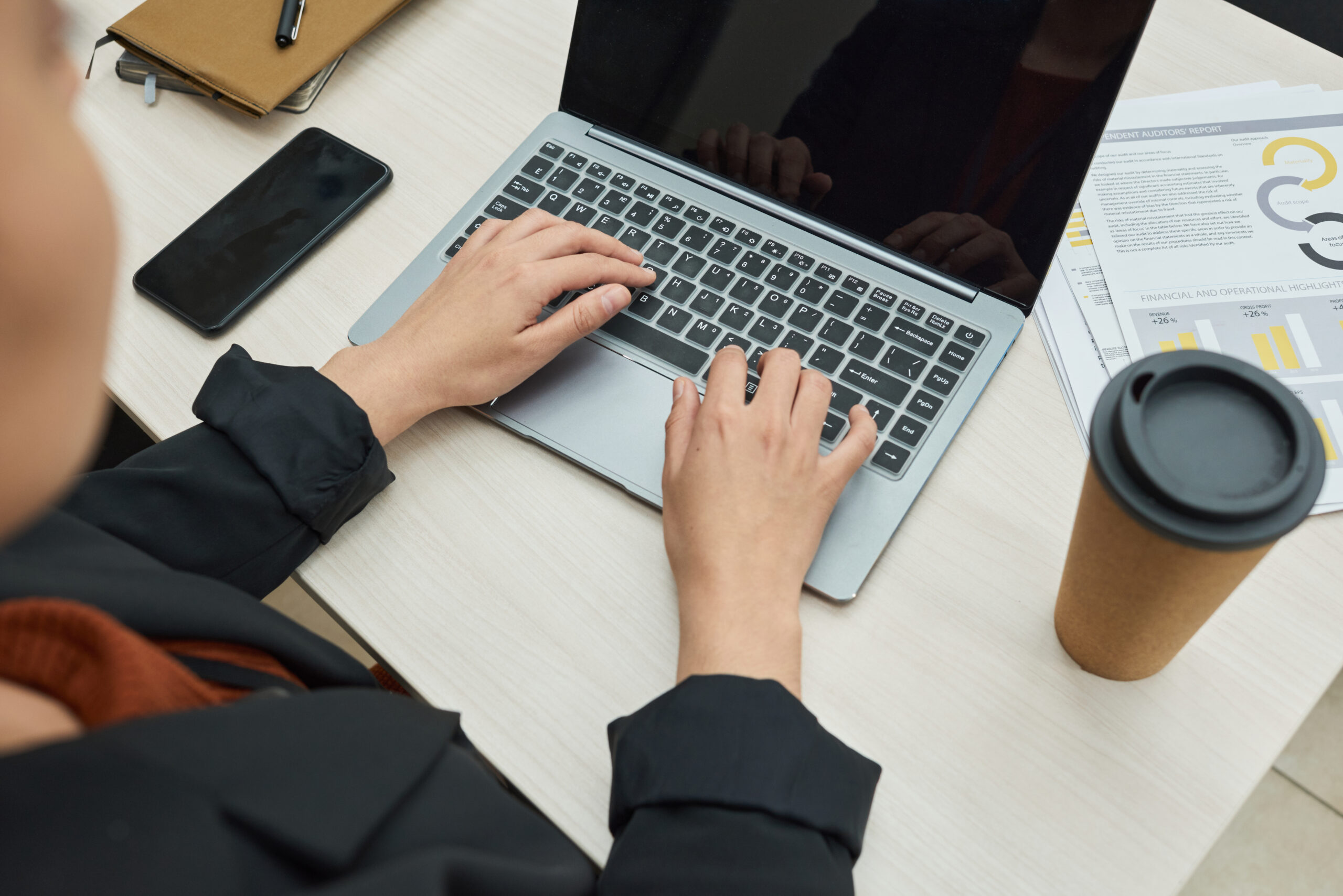 Cover image of the content Organizing the use of Plugins to help your organization, featuring a person working on the computer in a top-down view.