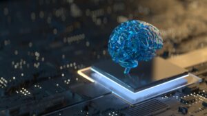 Capa que é uma foto de um pequeno cérebro em cima de uma máquina, representando o apoio da inteligência artificial.
